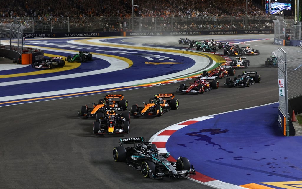 McLaren drivers Lando Norris and Oscar Piastri hot on the heels of Max Verstappen’s Red Bull as he chases race leader George Russell. Photo: Reuters McLaren drivers Lando Norris and Oscar Piastri hot on the heels of Max Verstappen’s Red Bull as he chases race leader George Russell. Photo: Reuters