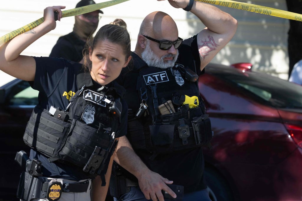 Officers investigate the scene where federal law enforcement agents reportedly shot a woman in Broadview, Illinois, on Saturday. Photo: AFP