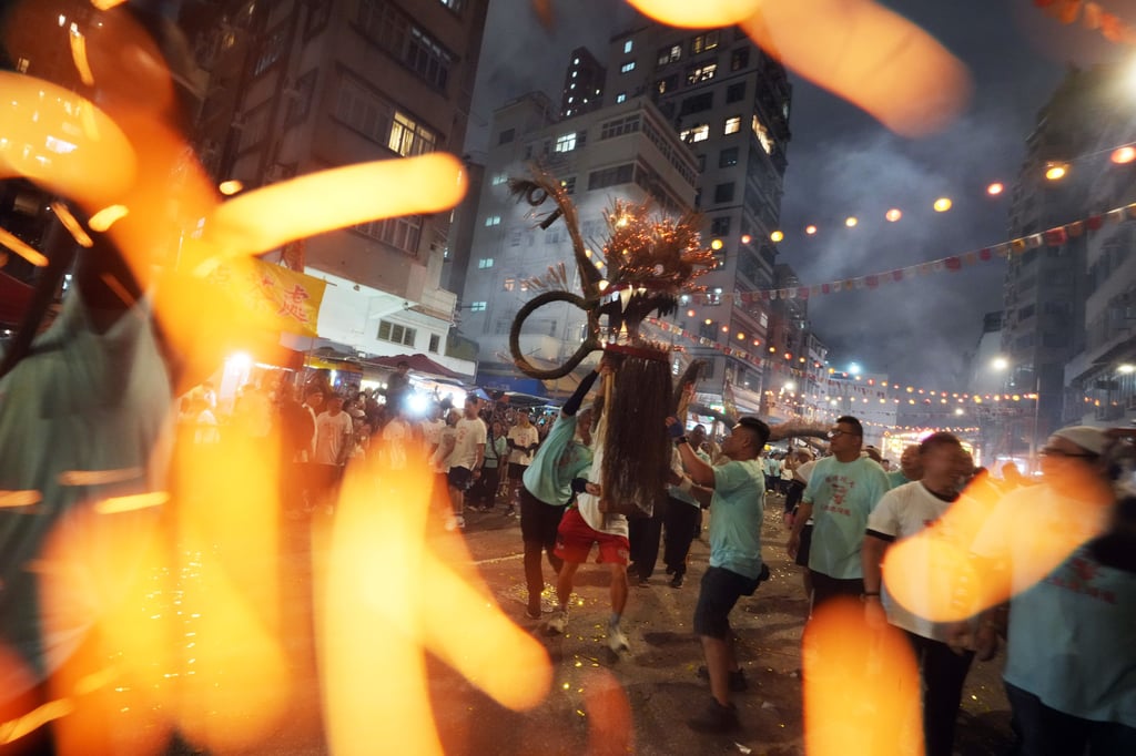 Troupe members raise the dragon aloft. Photo: Sam Tsang