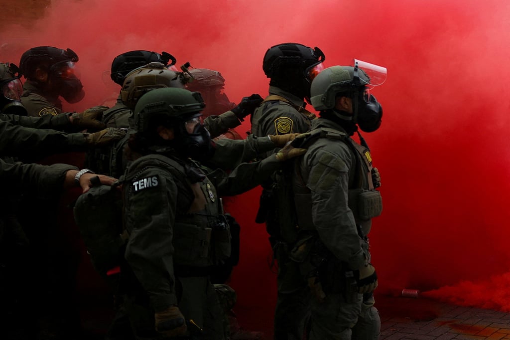 Law enforcement officers disperse demonstrators in front of a US Immigration and Customs Enforcement facility in Portland, Oregon. Photo: Reuters