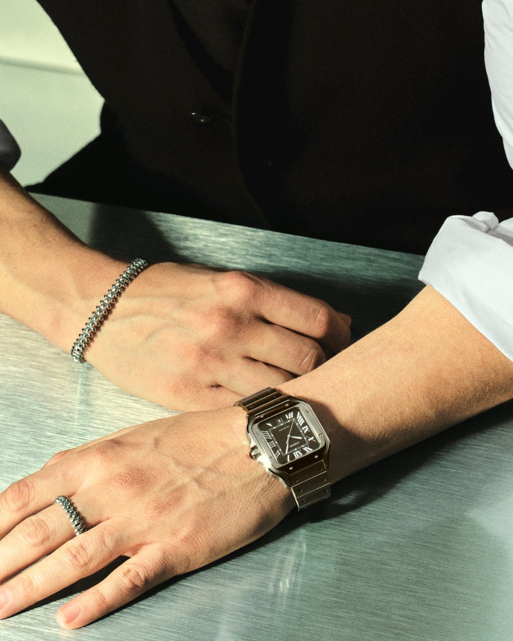 Sebastian Stan wearing the new Santos Black Dial. Handout