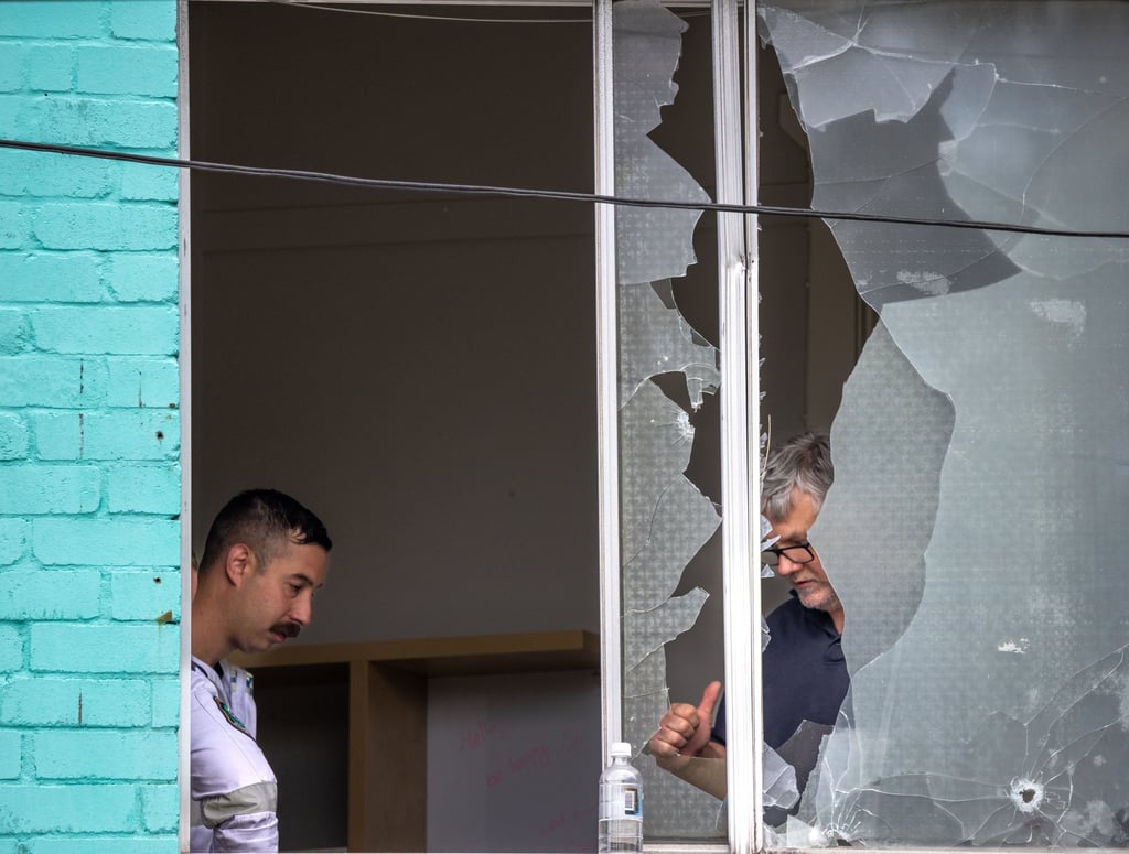 Police investigate a shooting in Croydon Park in Sydney on Monday. Photo: EPA Police investigate a shooting in Croydon Park in Sydney on Monday. Photo: EPA