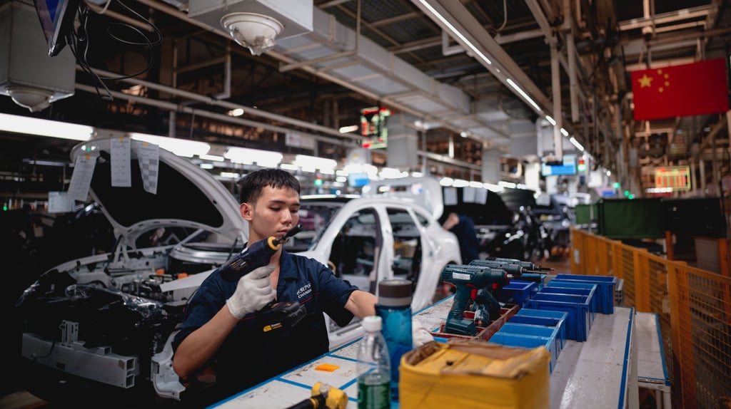 An employee works on an assembly line in Chongqing on May 20. Photo: EPA-EFE