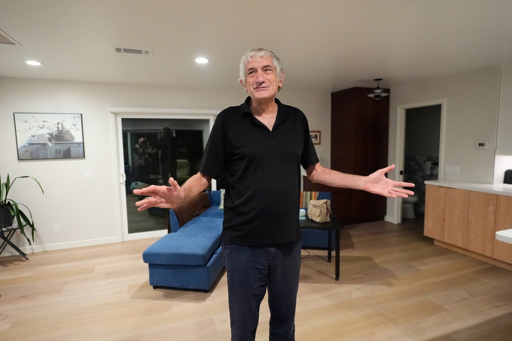 John Martinis stands in his living room after winning the Nobel Prize in Physics for his work on quantum tunnelling on Tuesday. Photo: AP John Martinis stands in his living room after winning the Nobel Prize in Physics for his work on quantum tunnelling on Tuesday. Photo: AP