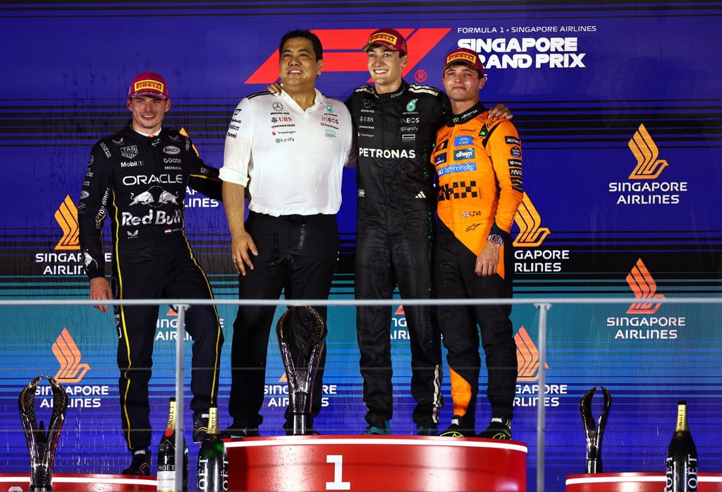 Mercedes’ George Russell (second from right) celebrates on the podium after winning the Singapore Grand Prix alongside Red Bull’s Max Verstappen, McLaren’s Lando Norris and Petronas CEO Tengku Muhammad Taufik Tengku Aziz. Photo: Reuters Mercedes’ George Russell (second from right) celebrates on the podium after winning the Singapore Grand Prix alongside Red Bull’s Max Verstappen, McLaren’s Lando Norris and Petronas CEO Tengku Muhammad Taufik Tengku Aziz. Photo: Reuters