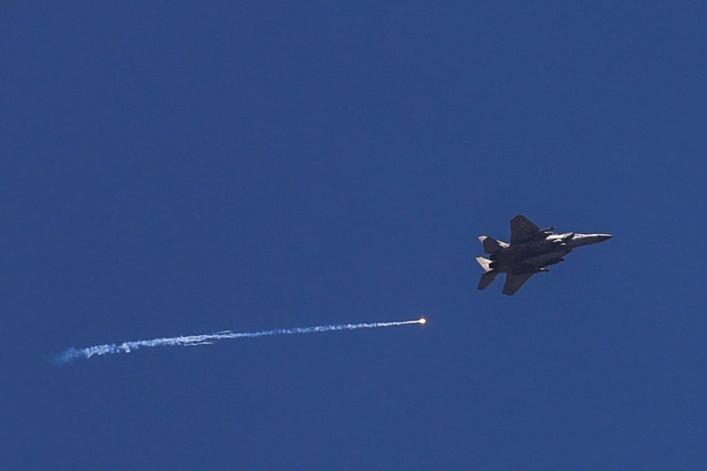 An Israeli jet flies over the Israel-Lebanon border amid cross-border hostilities in 2024. File photo: Reuters