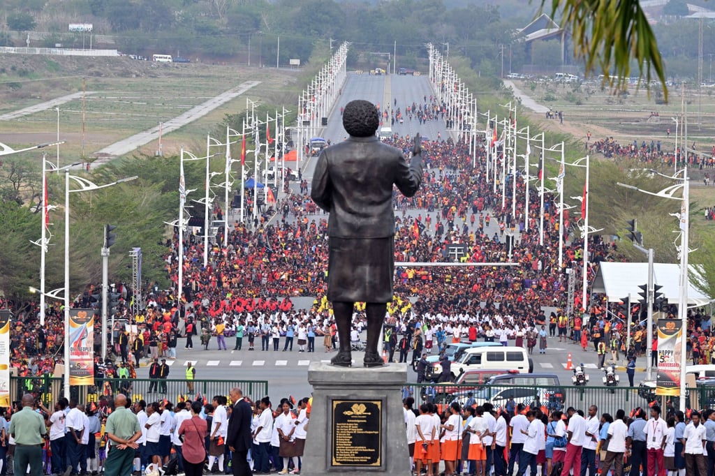 People stand in front of a statue of PNG’s first prime minister, Michael Somare, during a flag-raising ceremony in Port Moresby last month marking 50 years of independence from Australia. Photo: AAP/Reuters