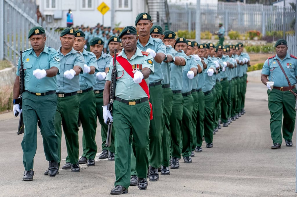 PNG soldiers march for an honour guard ceremony at Port Moresby International Airport last month. Photo: Government of Papua New Guinea/AFP