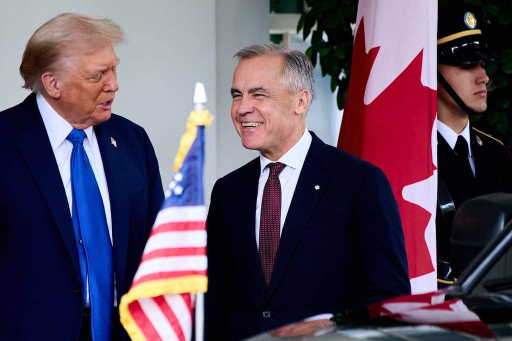 US President Donald Trump greets Canada’s Prime Minister Mark Carney, as he arrives at the White House on Tuesday. Photo: AP