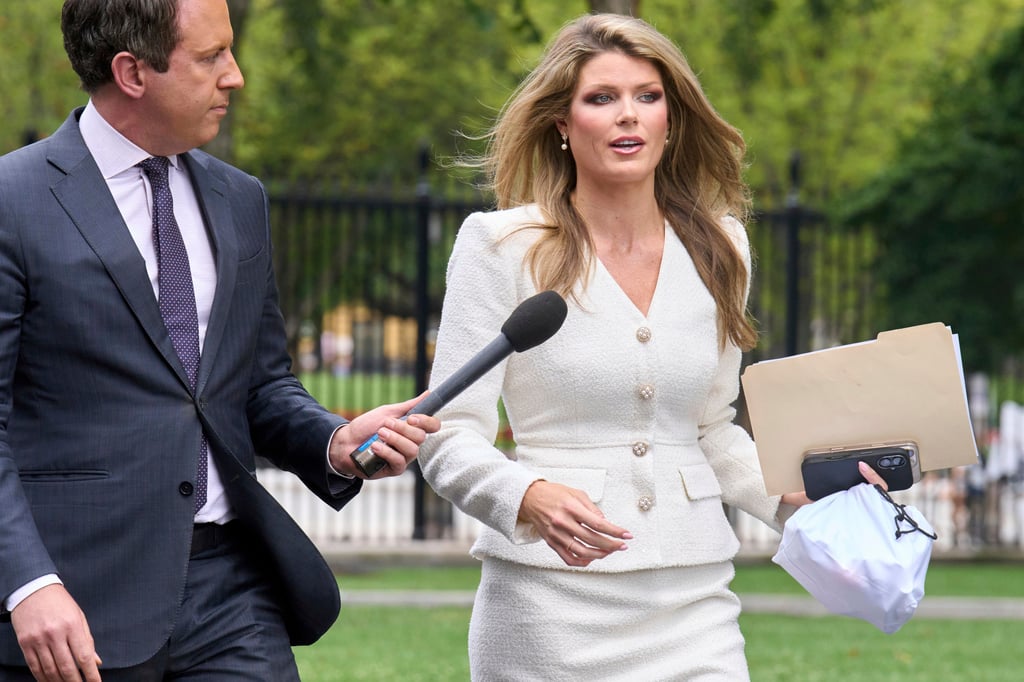Lindsey Halligan, special assistant to the US president, speaks with a reporter outside the White House in August. Photo: AP