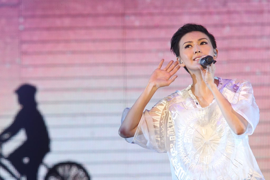 Singaporean singer Sun performs on stage in Hong Kong. She had to be persuaded to make her giving public. Photo: Getty Images