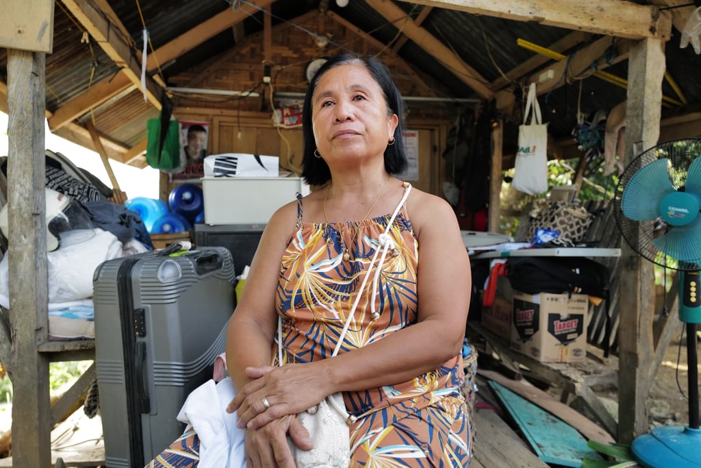 Vilma Lagnayo sits beside her destroyed house in Manay, Davao Oriental, after a magnitude 7.4 earthquake hit the southern Philippines on Friday. Photo: Jeoffrey Maitem Vilma Lagnayo sits beside her destroyed house in Manay, Davao Oriental, after a magnitude 7.4 earthquake hit the southern Philippines on Friday. Photo: Jeoffrey Maitem