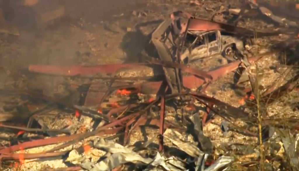 Debris covers the ground and vehicles after a powerful blast ripped through a military explosives manufacturing plant in Hickman County, Tennessee, on Friday. Photo: WTVF-TV/AP
