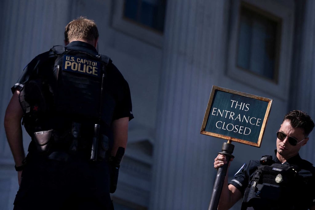 US Capitol Police close an entrance to the Capitol as the federal government continues its shutdown on Thursday. Photo: AFP US Capitol Police close an entrance to the Capitol as the federal government continues its shutdown on Thursday. Photo: AFP