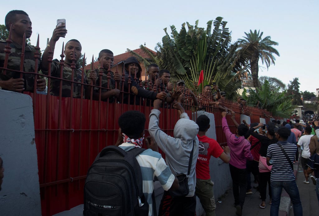 Protesters cheer members of the Madagascar military during a youth-led demonstration in the capital, Antananarivo, on Saturday. Photo: Reuters Protesters cheer members of the Madagascar military during a youth-led demonstration in the capital, Antananarivo, on Saturday. Photo: Reuters