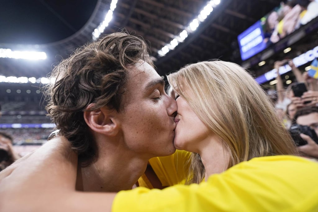 Armand Duplantis celebrates with his partner Desiré Inglander after winning the men’s pole vault with a world record vault of 6.30 metres at the World Athletics Championships in Tokyo, in September. Photo: Kyodo
