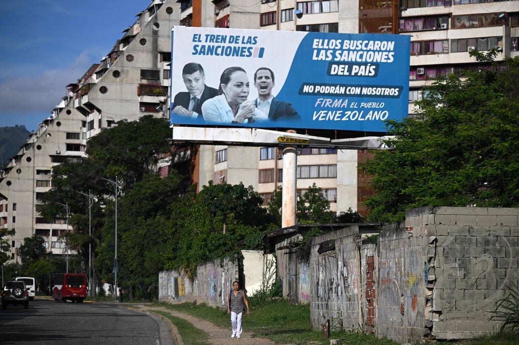 A billboard blaming opposition leaders for supporting US sanctions is displayed in Caracas, Venezuela, on October 10. Photo: AFP A billboard blaming opposition leaders for supporting US sanctions is displayed in Caracas, Venezuela, on October 10. Photo: AFP