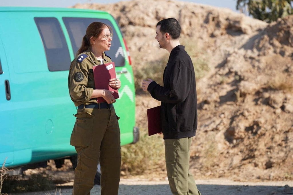 Israeli hostage Guy Gilboa-Dalal speaks with a representative of the Israeli army after being released. Photo: Israel Defence Forces via Reuters