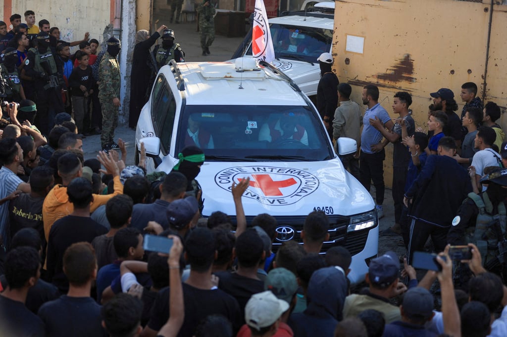 Red Cross vehicles transport hostages following their handover in Gaza City. Photo: Reuters Red Cross vehicles transport hostages following their handover in Gaza City. Photo: Reuters