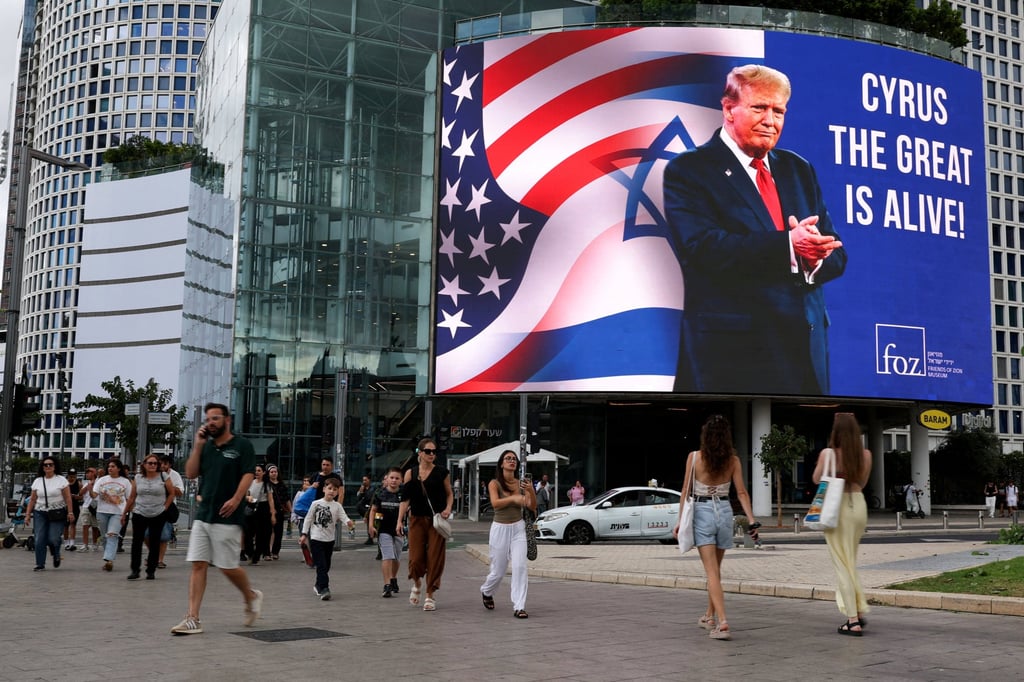 A billboard displays a picture of US President Donald Trump in Tel Aviv, Israel. Photo: Reuters
