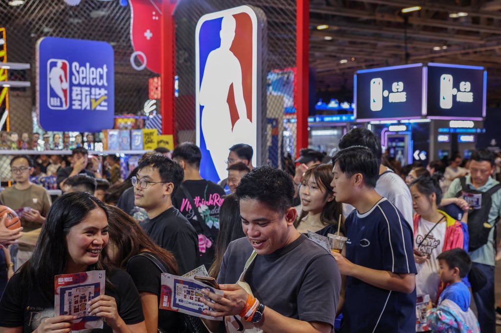 Fans queue up at a stall inside NBA House at the Venetian Arena in Macau, China. Photo: Reuters