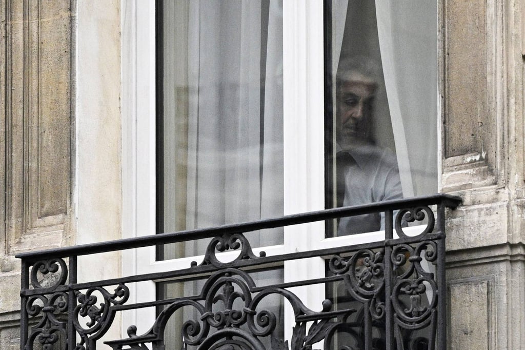 Nicolas Sarkozy at a window in his office in Paris. Photo: AFP