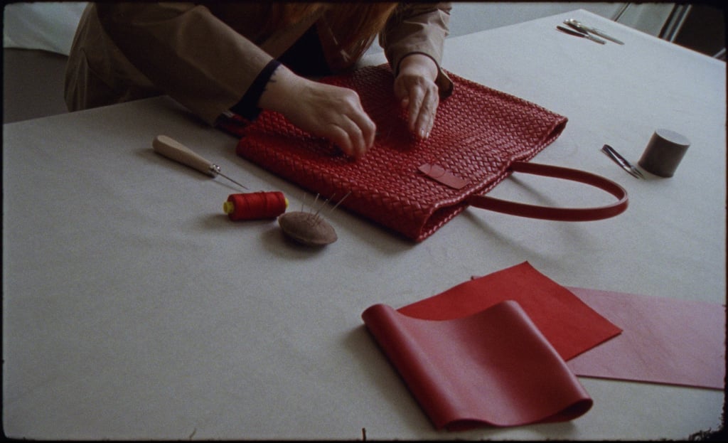 Putting the finishing touches to a Bottega Veneta leather bag. Photo: Handout