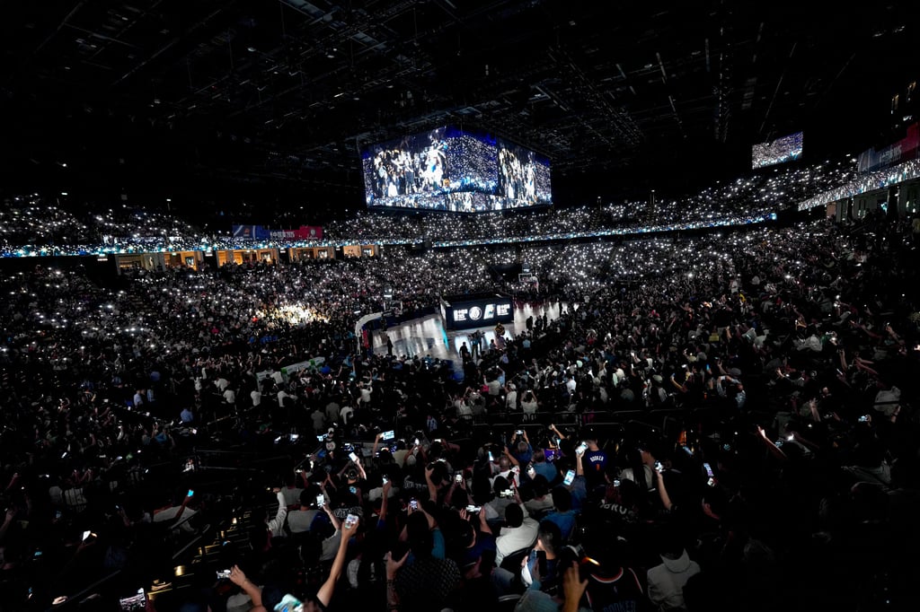 Fans hold up their phones during a break in play at The Venetian Arena. Photo: Karma Lo Fans hold up their phones during a break in play at The Venetian Arena. Photo: Karma Lo