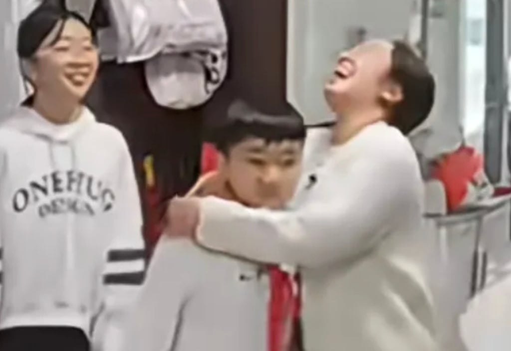 The family are clearly delighted with the boy’s slim pass mark and celebrate accordingly. Photo: Screen capture/Douyin