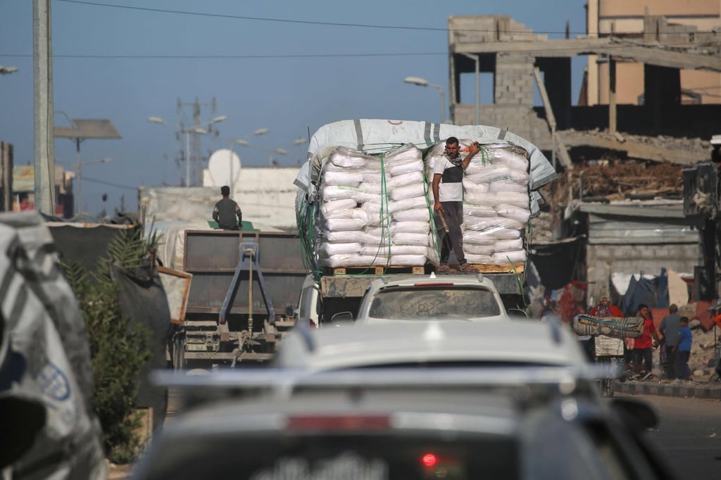 Trucks carrying aid drive past displacement tents at the Nuseirat refugee camp in the central Gaza Strip. Photo: AFP Trucks carrying aid drive past displacement tents at the Nuseirat refugee camp in the central Gaza Strip. Photo: AFP