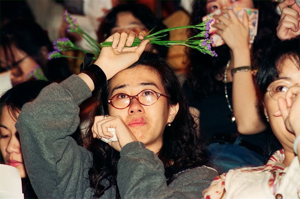 A fan weeping at Danny Chan’s memorial in 1993. Photo: SCMP Archives