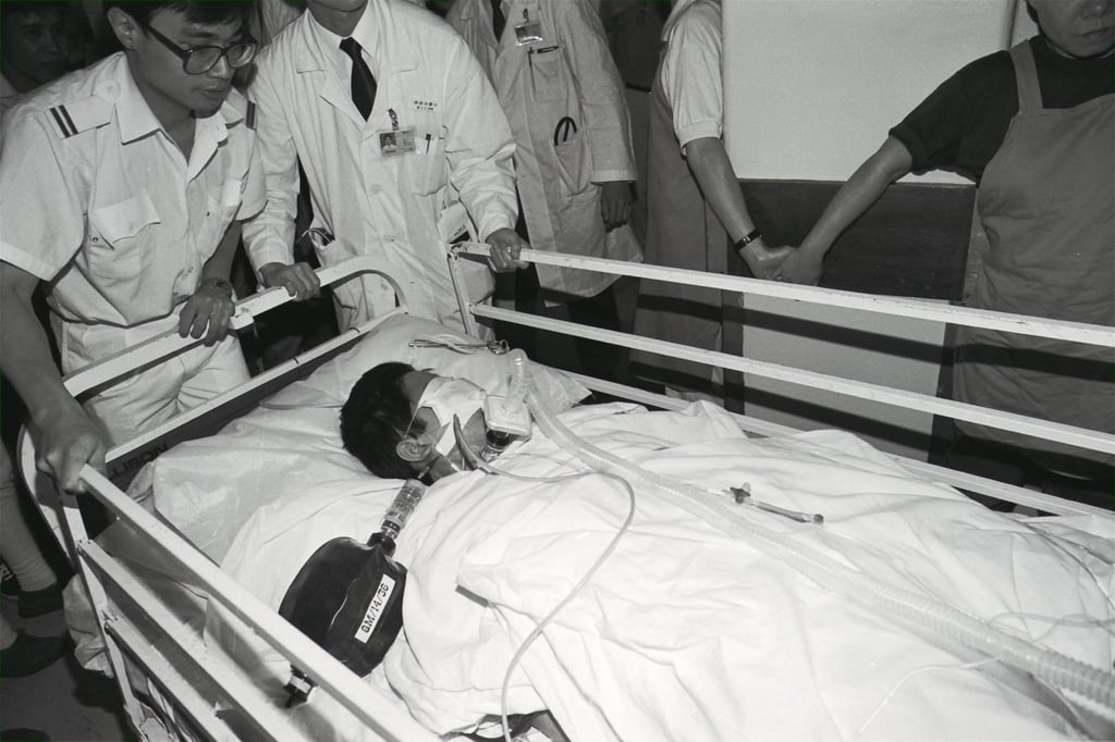 Canto-pop star Danny Chan Pak-keung is stretchered into Queen Mary Hospital after collapsing in his McDonnell Road home in May, 1992. Photo: SCMP Archive