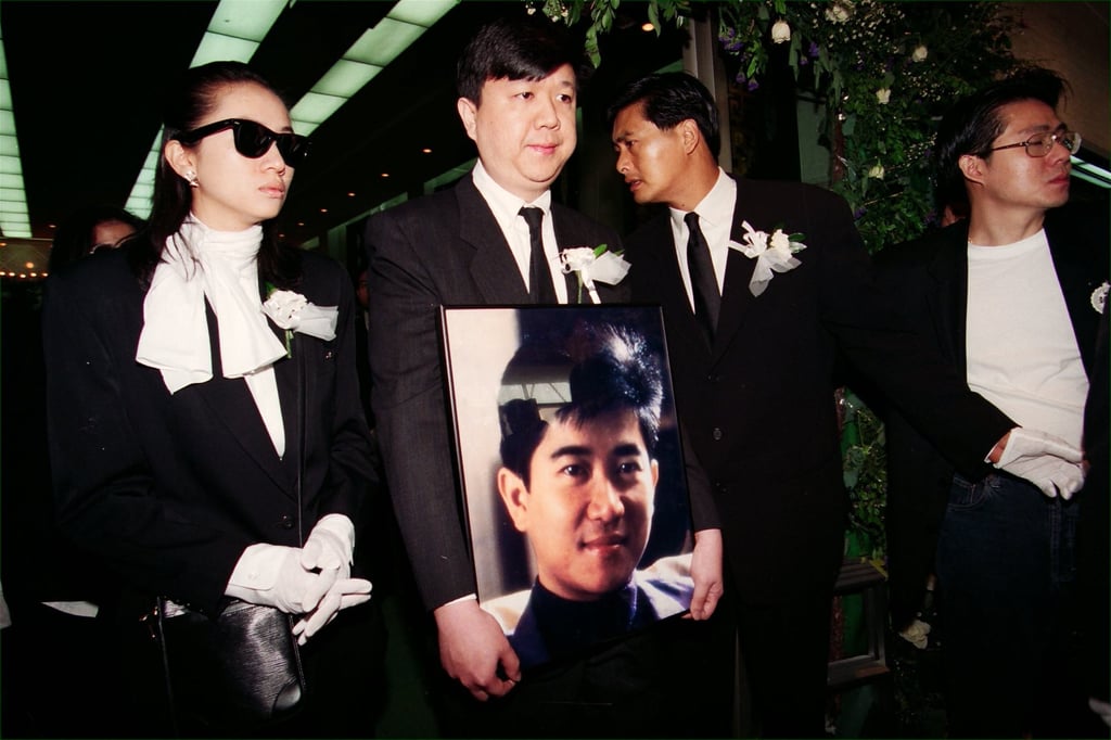 Singer Anita Mui Yim-fong (left) and actor Chow Yun-fat (second from right), with Chan Pak-ling (centre), elder brother of Danny Chan, carrying his brother’s picture at the funeral in 1993. Photo: SCMP Archives
