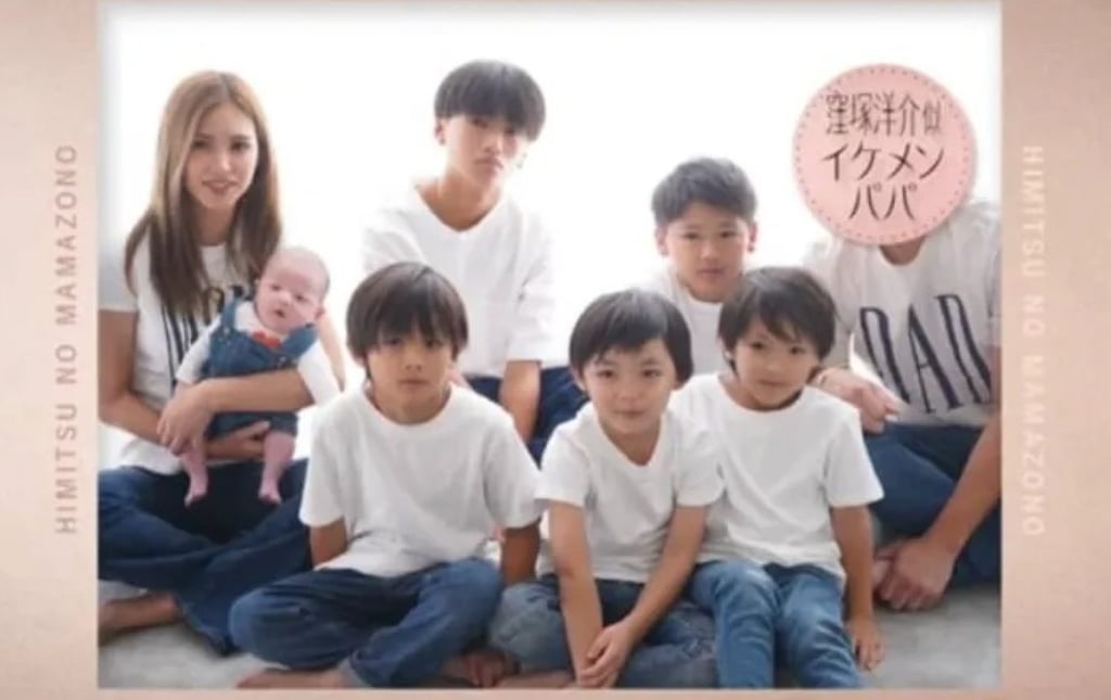 Mother Monko, far left, poses for a group photo with her six “handsome” sons. Photo: SCMPOST Mother Monko, far left, poses for a group photo with her six “handsome” sons. Photo: SCMPOST