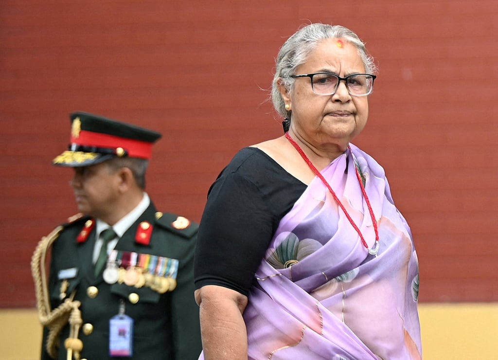 Nepal’s interim prime minister, Sushila Karki, arrives to attend an oath-taking ceremony for newly appointed ministers on September 22. Photo: Reuters Nepal’s interim prime minister, Sushila Karki, arrives to attend an oath-taking ceremony for newly appointed ministers on September 22. Photo: Reuters