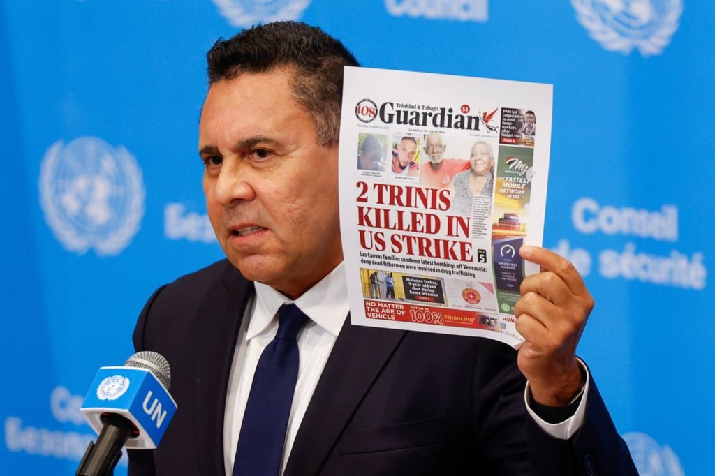 Venezuela’s UN ambassador Samuel Moncada holds up the cover story of local Trinidadian newspaper Guardian on the deaths. Photo: Reuters Venezuela’s UN ambassador Samuel Moncada holds up the cover story of local Trinidadian newspaper Guardian on the deaths. Photo: Reuters