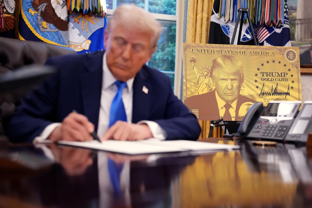 US President Donald Trump signs a series of executive orders establishing the “Trump Gold Card” and introducing a US$100,000 fee for H-1B visas at the White House in September. Photo: TNS US President Donald Trump signs a series of executive orders establishing the “Trump Gold Card” and introducing a US$100,000 fee for H-1B visas at the White House in September. Photo: TNS