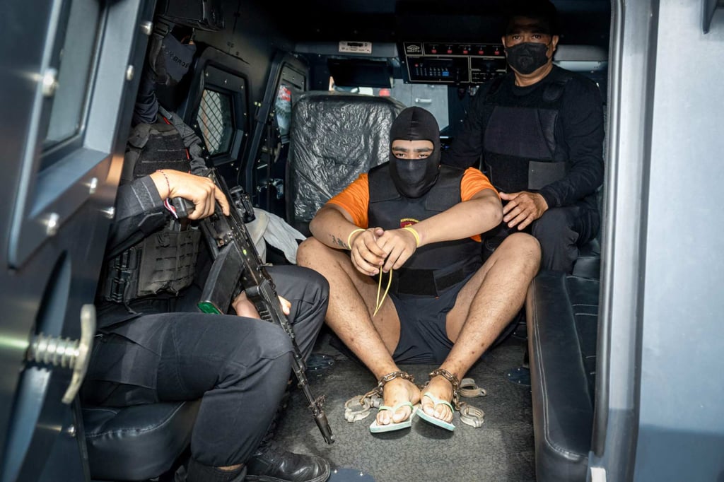 Australian suspect Mevlut Coskun (centre) is escorted back to a prison after being questioned by prosecutors in Badung, Bali, on Wednesday. Photo: AFP Australian suspect Mevlut Coskun (centre) is escorted back to a prison after being questioned by prosecutors in Badung, Bali, on Wednesday. Photo: AFP