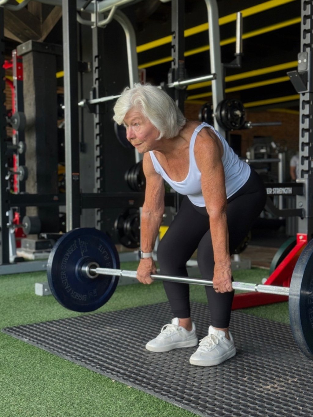 Joan MacDonald lifts weights at the gym. Photo: Joan MacDonald