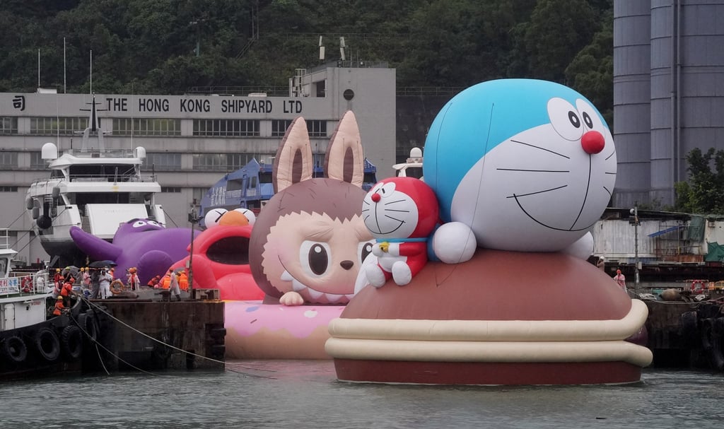 Four giant floating sculptures of (from front) Doraemon, Labubu, Elmo and Grimace are taken for a sea trial in the waters off Tsing Yi, Hong Kong. Photo: Elson Li Four giant floating sculptures of (from front) Doraemon, Labubu, Elmo and Grimace are taken for a sea trial in the waters off Tsing Yi, Hong Kong. Photo: Elson Li