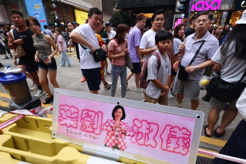 A fan group celebrates lawmaker Regina Ip Lau’s 75th birthday in Causeway Bay on August 24. The celebration, organised by a Facebook group of supporters, drew a sizeable and enthusiastic crowd outside Causeway Bay’s Sogo department store. Photo: Dickson Lee A fan group celebrates lawmaker Regina Ip Lau’s 75th birthday in Causeway Bay on August 24. The celebration, organised by a Facebook group of supporters, drew a sizeable and enthusiastic crowd outside Causeway Bay’s Sogo department store. Photo: Dickson Lee