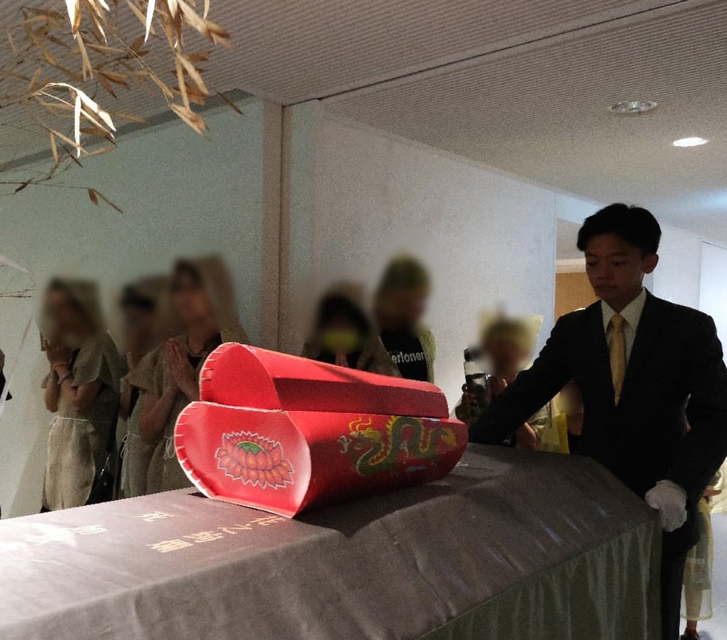 A miniature paper coffin is placed on top of a real coffin at a funeral ceremony before it is burned alongside to prevent further deaths in the family. Photo: sunshines.com.tw A miniature paper coffin is placed on top of a real coffin at a funeral ceremony before it is burned alongside to prevent further deaths in the family. Photo: sunshines.com.tw