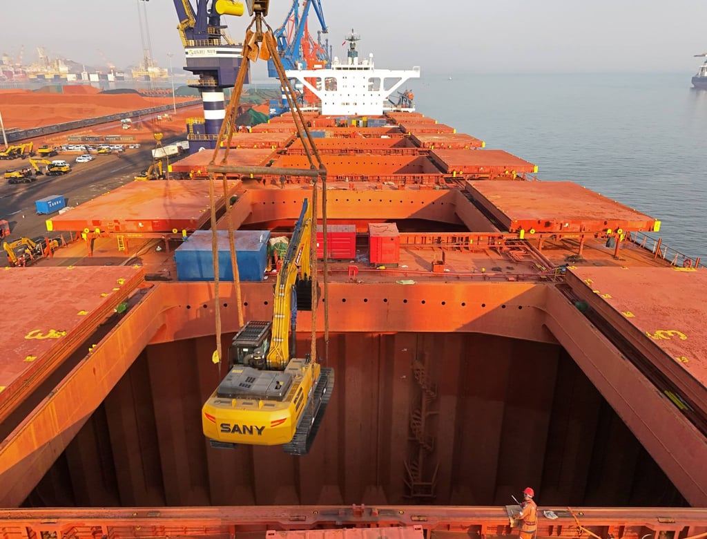 A crane loads a Sany digger onto a cargo ship at a port in Yantai in east China’s Shandong province. Photo: Feature China/Future Publishing via Getty Images A crane loads a Sany digger onto a cargo ship at a port in Yantai in east China’s Shandong province. Photo: Feature China/Future Publishing via Getty Images