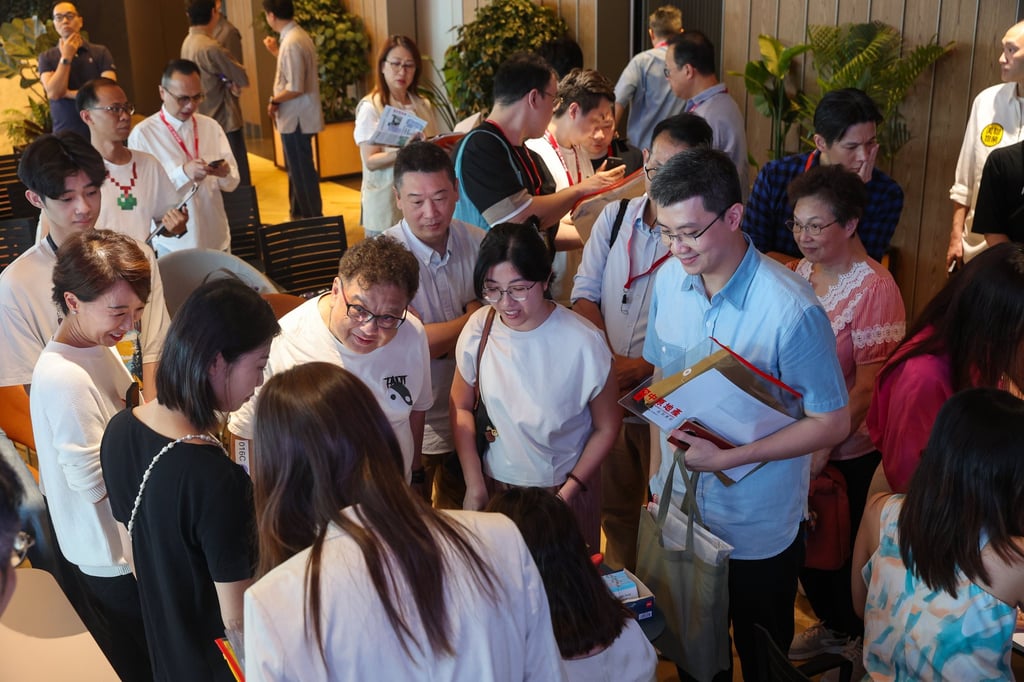 Potential buyers and property agents at the sales office of a Wan Chai residential project. Photo: Edmond So Potential buyers and property agents at the sales office of a Wan Chai residential project. Photo: Edmond So