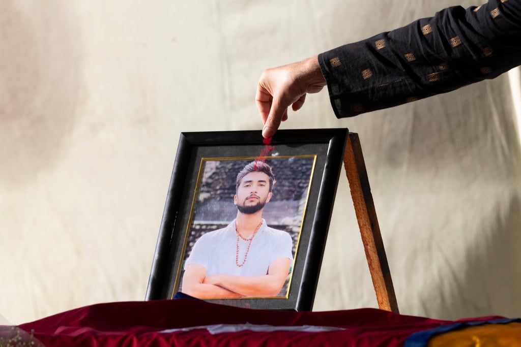 Nepalese people mourn next to the coffin of late Nepalese hostage Bipin Joshi on Monday. Photo: EPA Nepalese people mourn next to the coffin of late Nepalese hostage Bipin Joshi on Monday. Photo: EPA