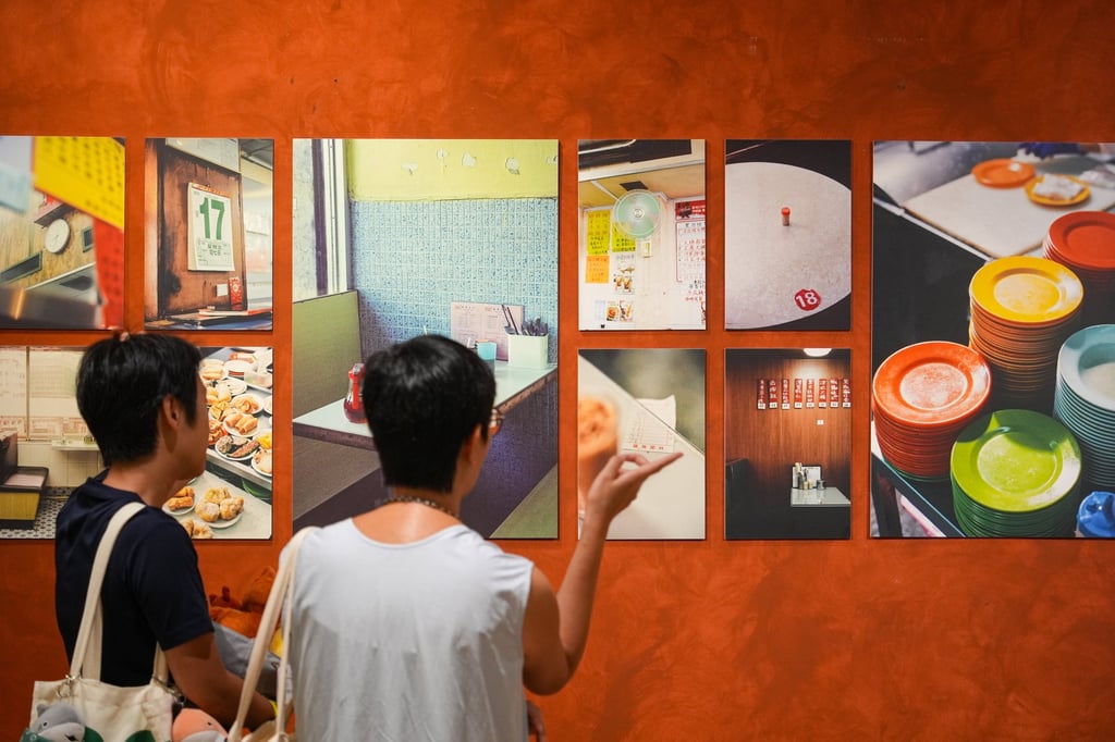 Visitors browse works at the “Jo Cha Photography Club” exhibition at the K11 Art Mall’s How To Live Well store. Photo: Eugene Lee Visitors browse works at the “Jo Cha Photography Club” exhibition at the K11 Art Mall’s How To Live Well store. Photo: Eugene Lee
