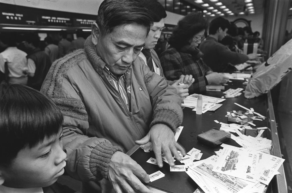 A philatelist sorts his stamps at a post office in 1984. Photo: SCMP Archives A philatelist sorts his stamps at a post office in 1984. Photo: SCMP Archives