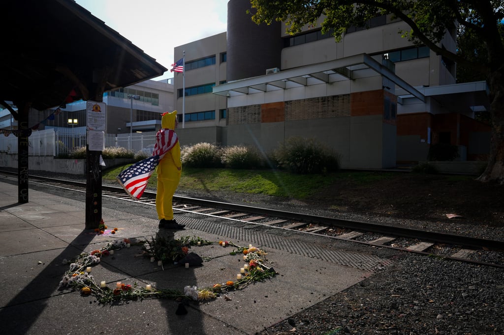 A man dressed in a chicken costume outside an ICE facility in Portland. Photo: AP A man dressed in a chicken costume outside an ICE facility in Portland. Photo: AP
