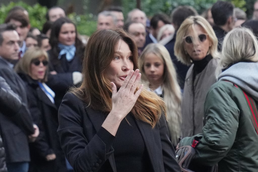 Carla Bruni blows a kiss as her husband heads to prison. Photo: AP Carla Bruni blows a kiss as her husband heads to prison. Photo: AP