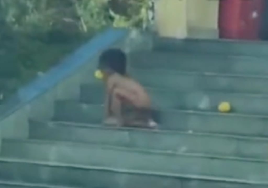Social media users expressed shock upon witnessing the boy behaving like a dog, picking up food from the ground with his mouth and sniffing it before eating. Photo: Douyin Social media users expressed shock upon witnessing the boy behaving like a dog, picking up food from the ground with his mouth and sniffing it before eating. Photo: Douyin